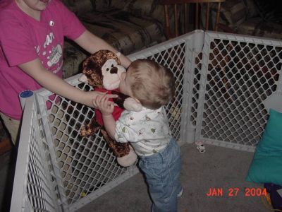 Braydon in playpen.JPG