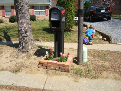 Anglea flower bed
Angela gets creative with all of our leftover bricks and make a flower bed for the mailbox
